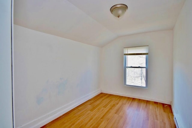 5 Plank Rd, Mongaup Valley, NY 12762 - spare room with baseboards, light wood-style flooring, and vaulted ceiling