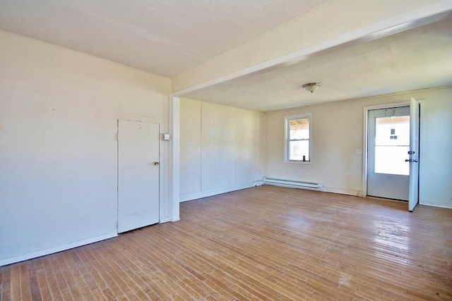 5 Plank Rd, Mongaup Valley, NY 12762 - empty room featuring a baseboard heating unit, wood finished floors, and baseboards