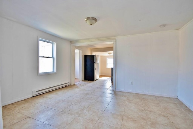 5 Plank Rd, Mongaup Valley, NY 12762 - empty room with light tile patterned floors, plenty of natural light, a baseboard heating unit, and baseboards