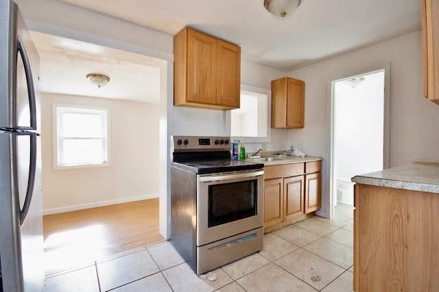 5 Plank Rd, Mongaup Valley, NY 12762 - kitchen with light tile patterned flooring, baseboards, stainless steel appliances, and light countertops