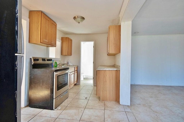 5 Plank Rd, Mongaup Valley, NY 12762 - kitchen with light tile patterned floors, electric stove, freestanding refrigerator, and light countertops