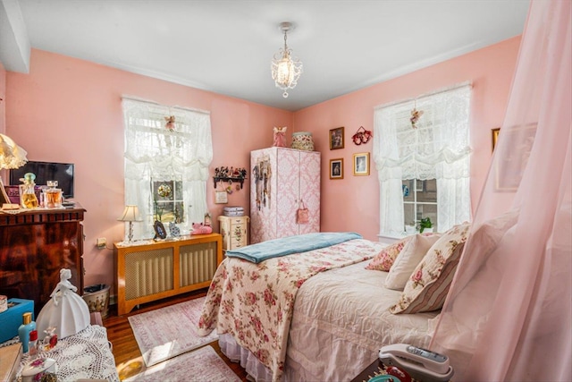 bedroom featuring wood finished floors