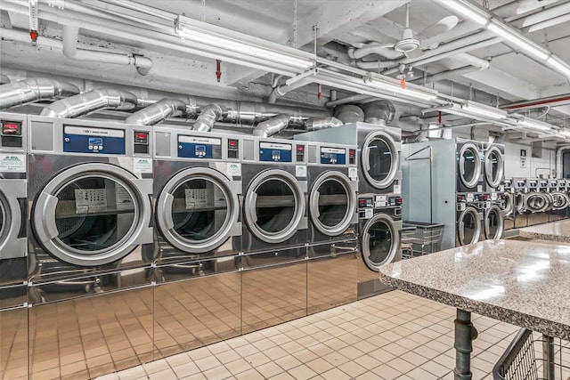 common laundry area with stacked washer / dryer, independent washer and dryer, and tile patterned floors