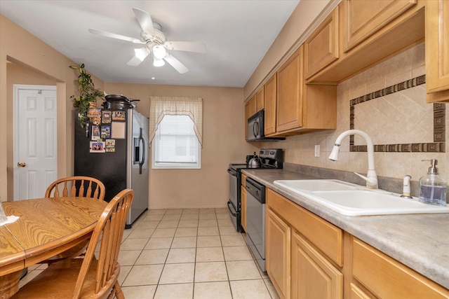 kitchen with ceiling fan, light tile patterned floors, decorative backsplash, appliances with stainless steel finishes, and a sink