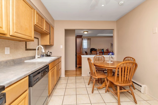 kitchen with a sink, tasteful backsplash, stainless steel dishwasher, light tile patterned flooring, and a baseboard radiator