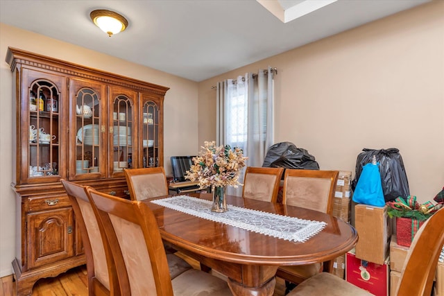 dining area with light wood-style floors