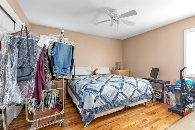 bedroom with wood finished floors and ceiling fan