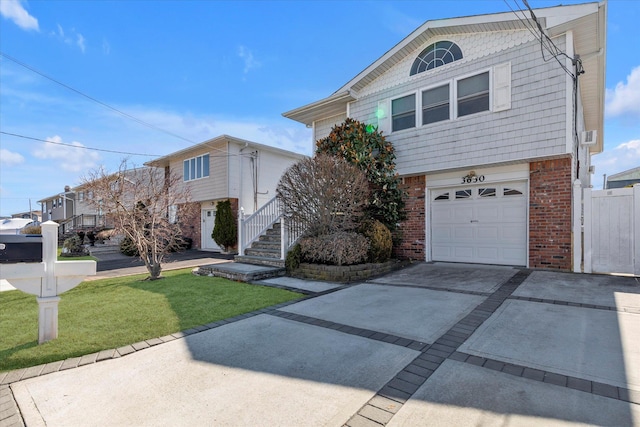 view of front of house featuring brick siding, an attached garage, concrete driveway, and a front lawn