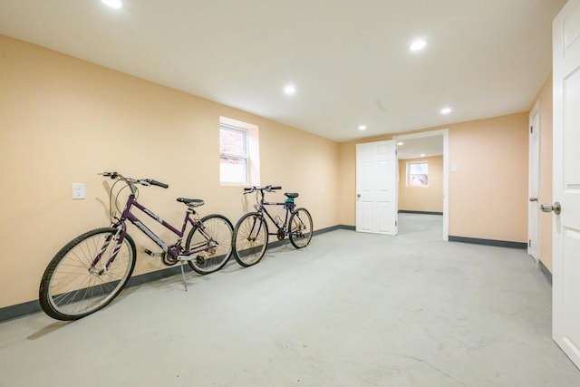 interior space with baseboards and recessed lighting