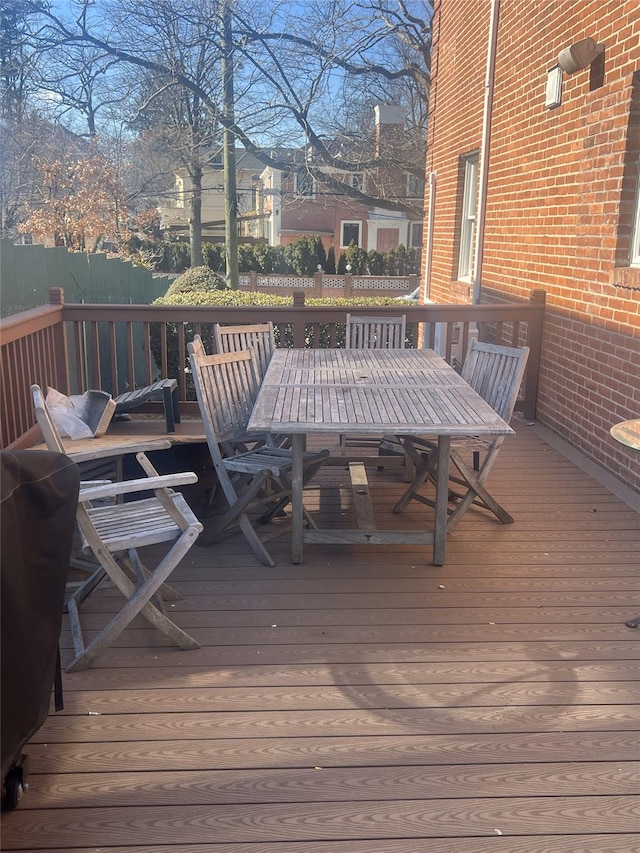 wooden terrace with outdoor dining space