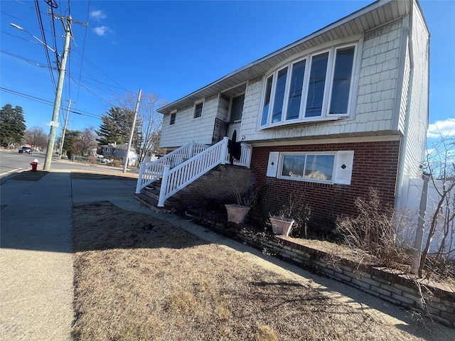 split foyer home with brick siding