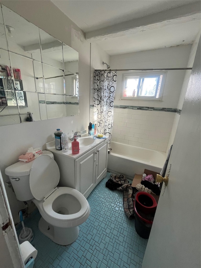 bathroom featuring toilet, shower / bath combo with shower curtain, and vanity