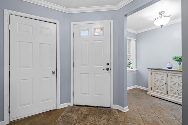 entrance foyer featuring ornamental molding, baseboards, and tile patterned floors