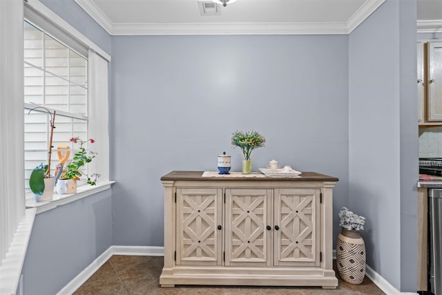 details featuring baseboards, visible vents, and crown molding