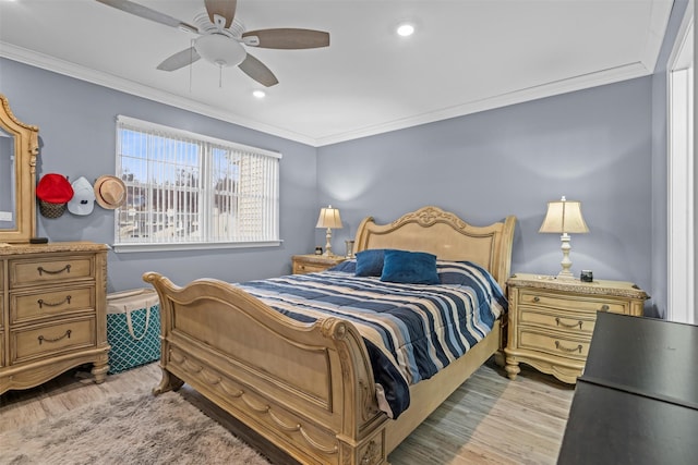 bedroom featuring a ceiling fan, recessed lighting, light wood-style flooring, and crown molding