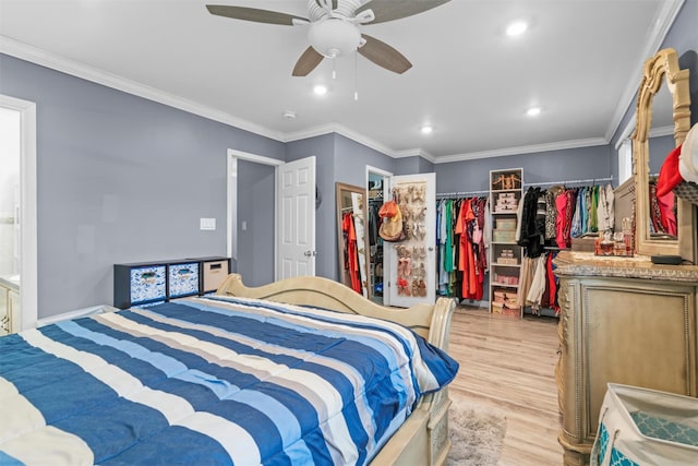 bedroom featuring light wood-type flooring, ornamental molding, and recessed lighting