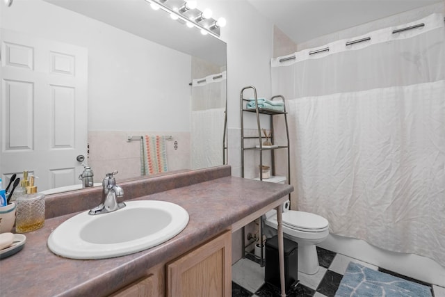 full bathroom featuring toilet, shower / tub combo, and vanity