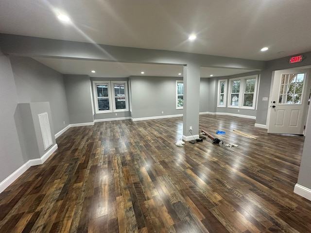 interior space featuring baseboards, dark wood-type flooring, and recessed lighting