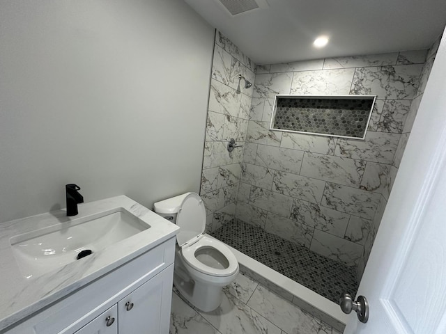 full bath with visible vents, marble finish floor, a tile shower, and toilet