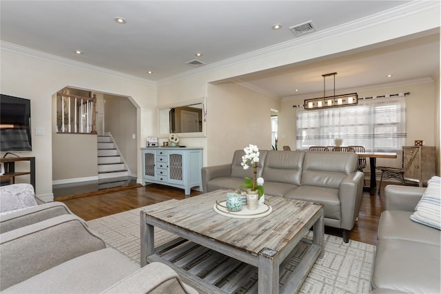 living room featuring recessed lighting, visible vents, stairway, and wood finished floors