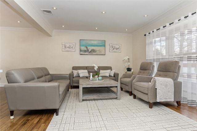 living area featuring ornamental molding, wood finished floors, visible vents, and recessed lighting