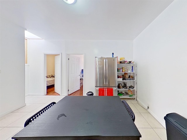 game room with light tile patterned floors and baseboards