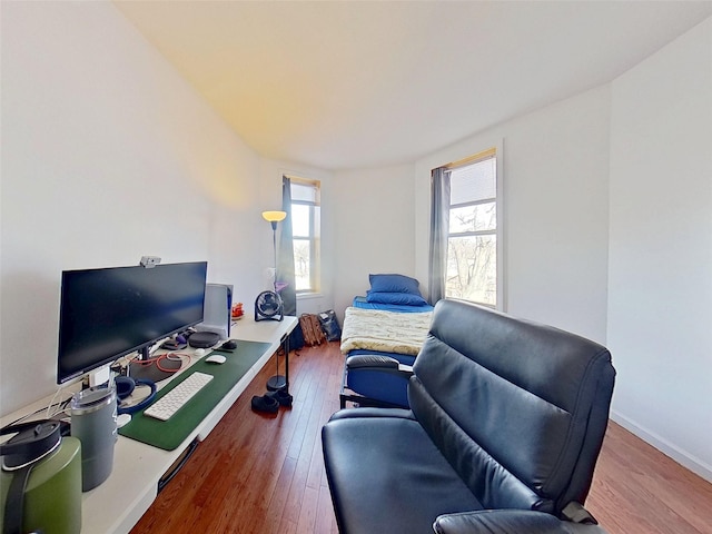 office space featuring wood-type flooring and baseboards