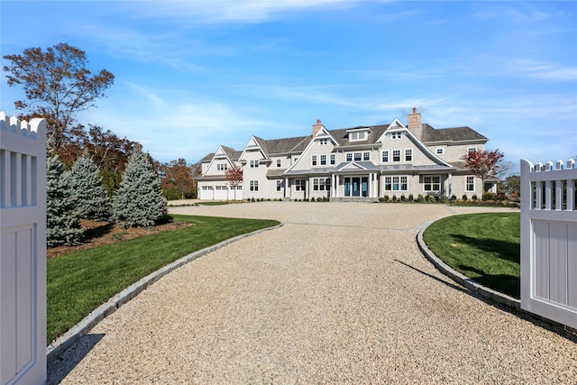 exterior space featuring a chimney and a front lawn