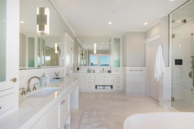 full bath featuring a sink, two vanities, tile walls, and a shower stall