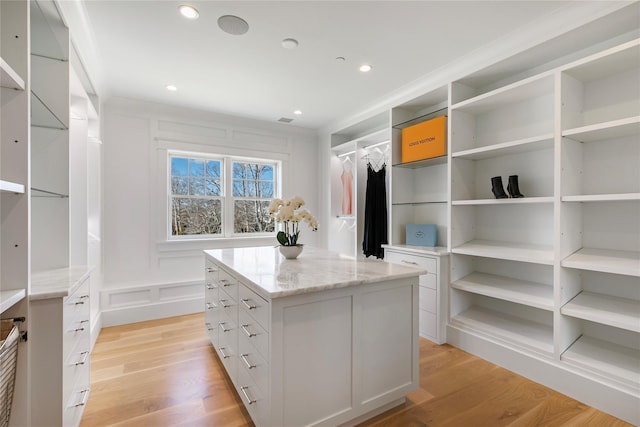 spacious closet with light wood-style flooring