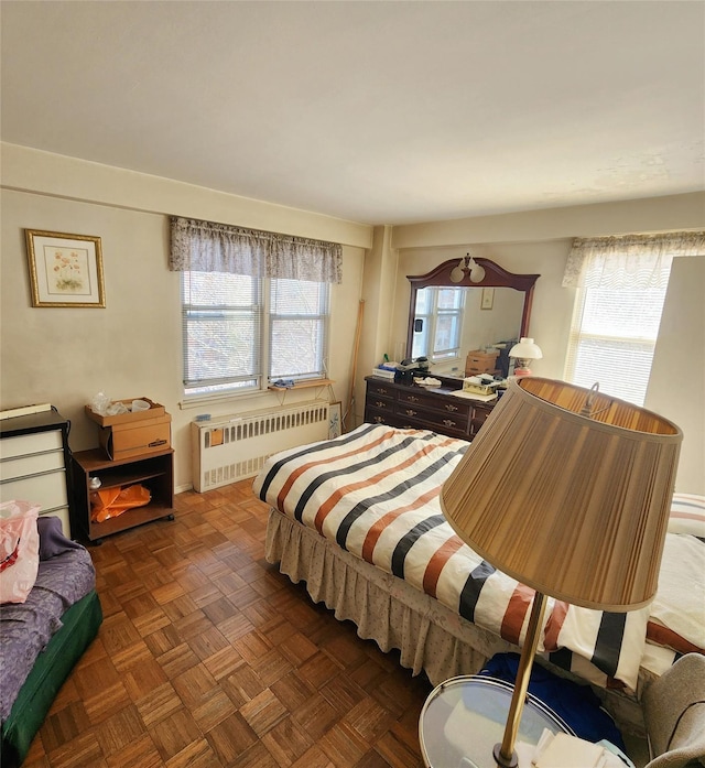 bedroom featuring radiator heating unit