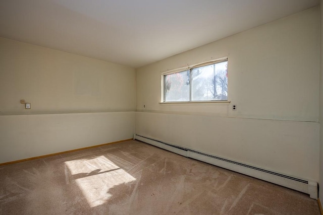 unfurnished room featuring baseboards, baseboard heating, and carpet