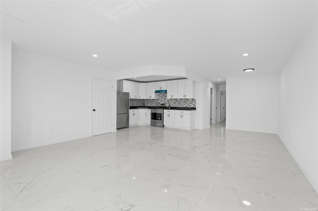 unfurnished living room with marble finish floor, baseboards, and recessed lighting