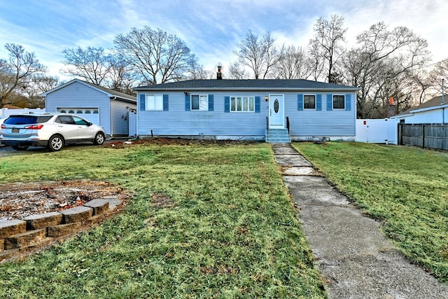 ranch-style house with entry steps, fence, a garage, an outdoor structure, and a front lawn