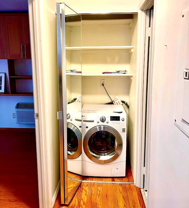 laundry room with hookup for a washing machine, laundry area, and wood finished floors