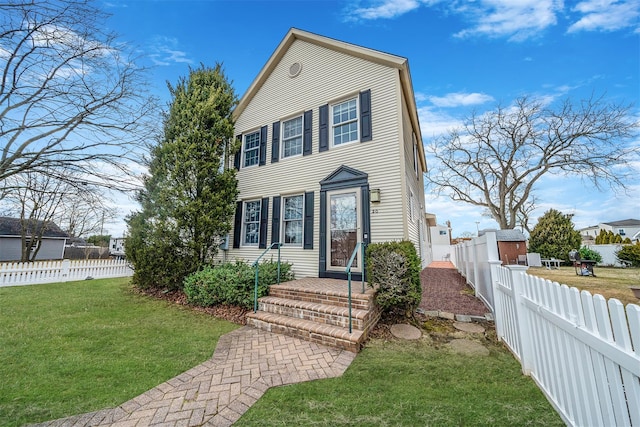 view of front of property with a front lawn and fence private yard