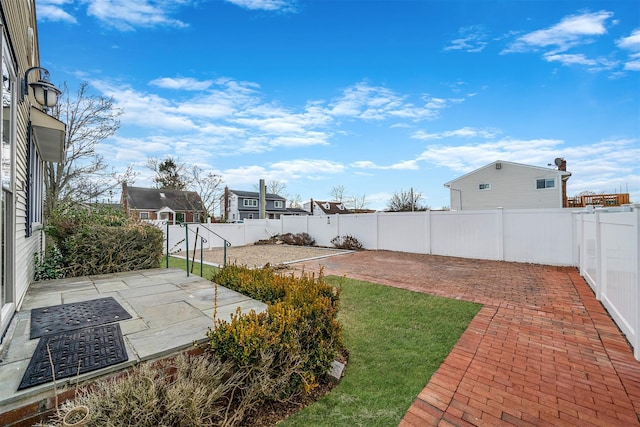 view of yard featuring a fenced backyard and a patio