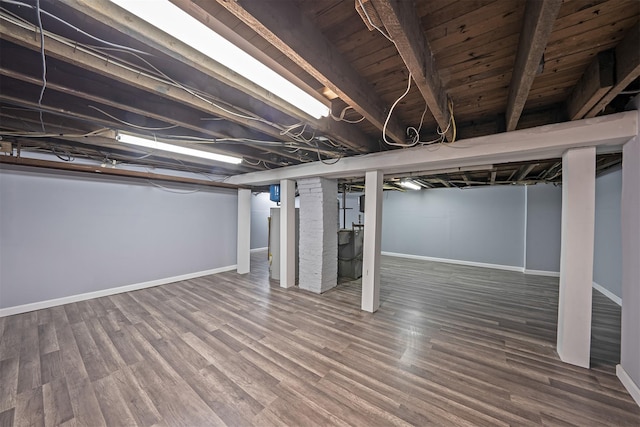 basement with wood finished floors and baseboards