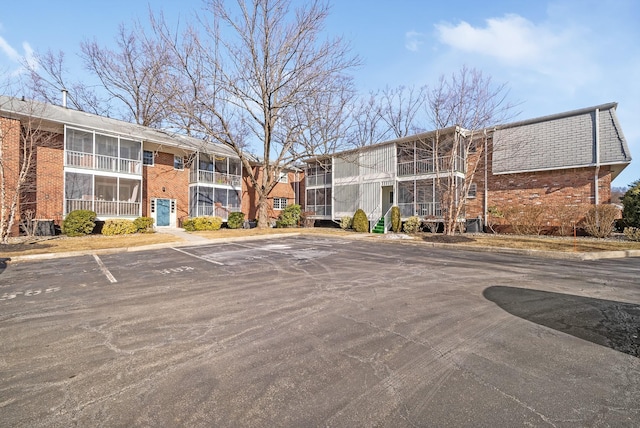 view of property with uncovered parking