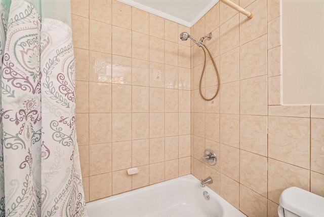 bathroom featuring toilet, ornamental molding, and shower / bath combination with curtain