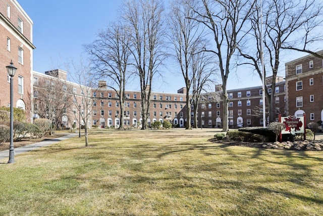 view of property's community with a yard