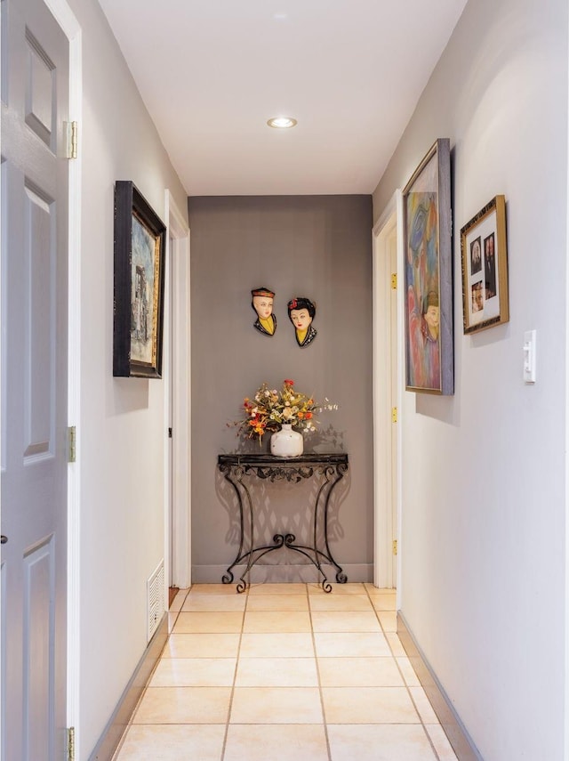 hallway featuring recessed lighting and light tile patterned flooring