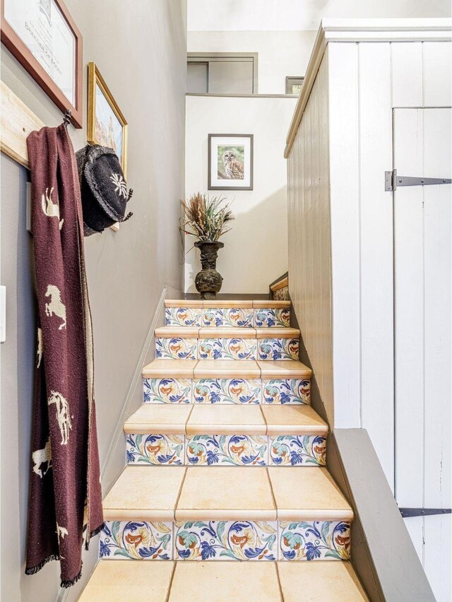 staircase with tile patterned flooring