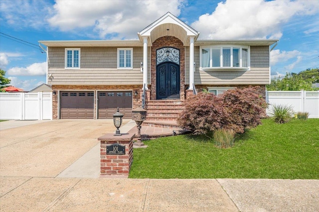 101 Jetmore Pl, Massapequa, NY 11758 - split foyer home with fence, an attached garage, driveway, and a front yard