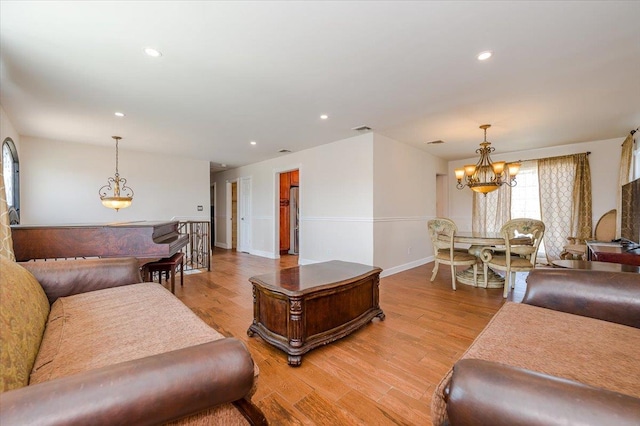 101 Jetmore Pl, Massapequa, NY 11758 - living area featuring visible vents, baseboards, recessed lighting, light wood-style flooring, and a notable chandelier