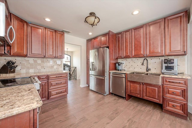 101 Jetmore Pl, Massapequa, NY 11758 - kitchen featuring backsplash, recessed lighting, appliances with stainless steel finishes, and light wood-type flooring