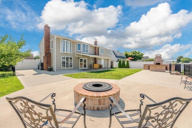 101 Jetmore Pl, Massapequa, NY 11758 - rear view of house with fence, a chimney, a patio area, and a fireplace
