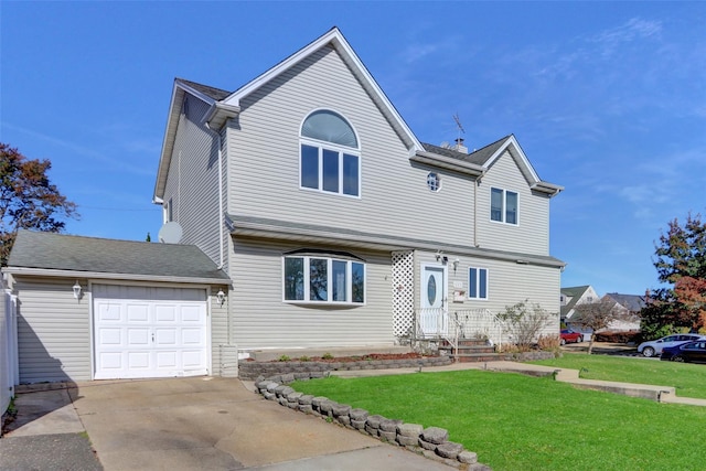 traditional-style home featuring an attached garage, concrete driveway, and a front yard