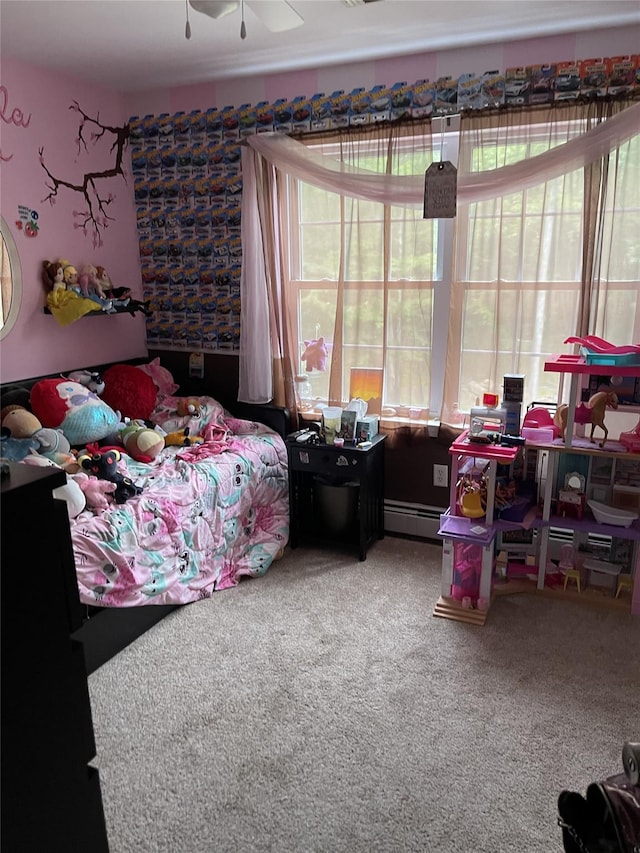 carpeted bedroom featuring baseboard heating