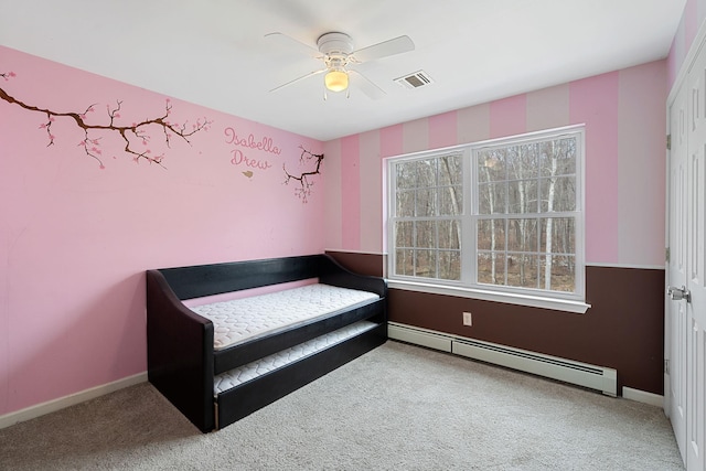 bedroom with baseboard heating, carpet flooring, baseboards, and visible vents